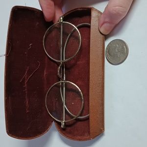 Vintage eyeglasses with brown velvet lined case